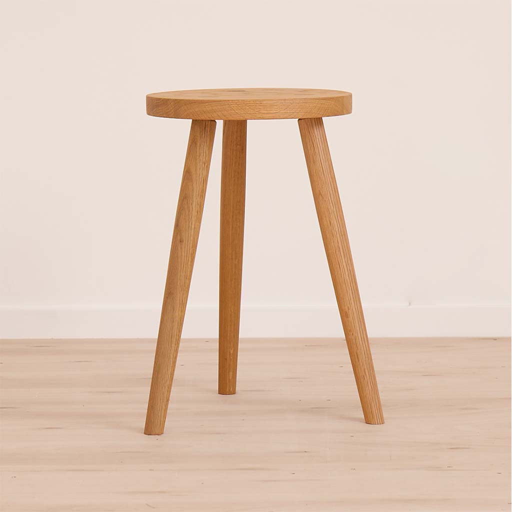 A hand crafted stool fashioned from solid oak