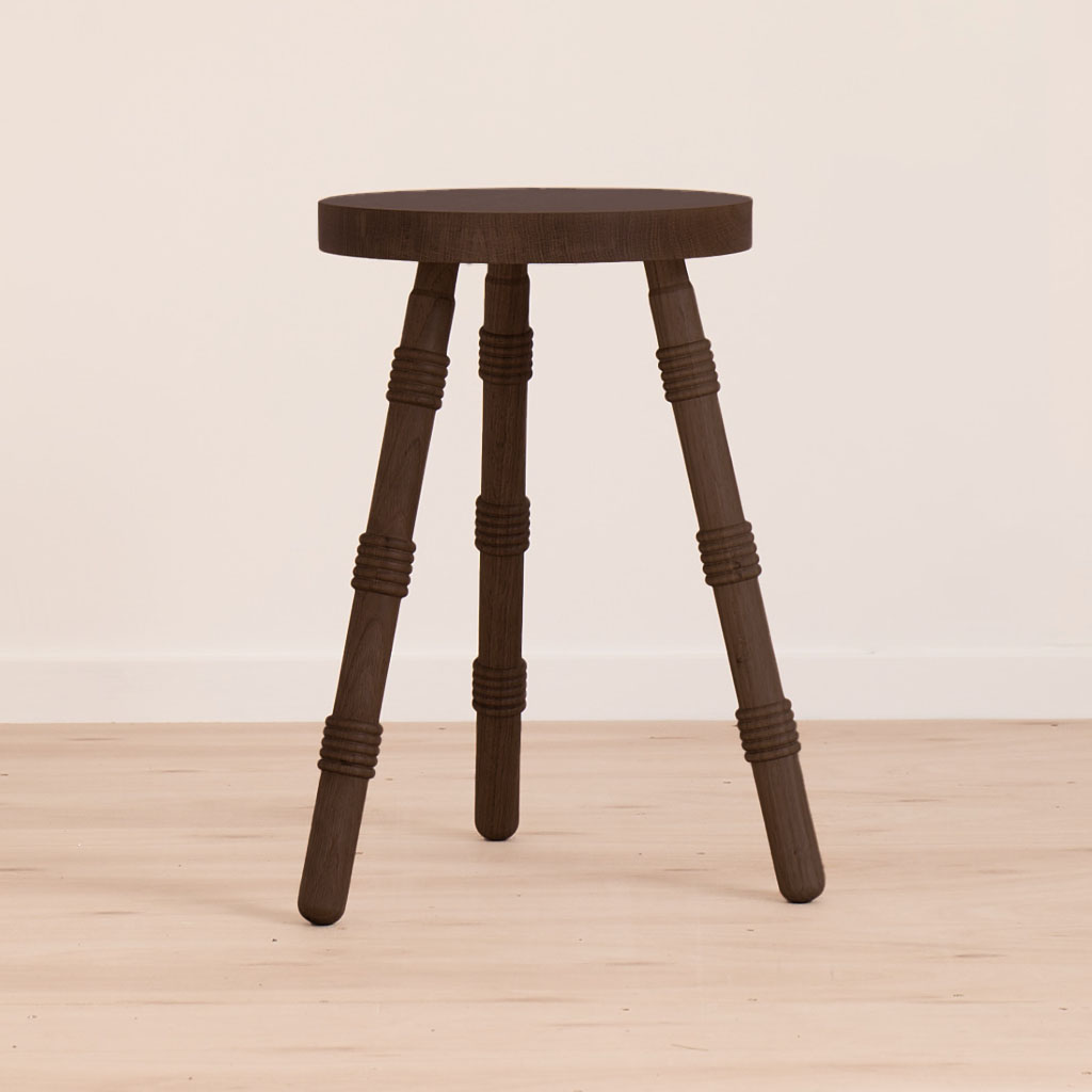A handmade stool crafted from ebonised oak