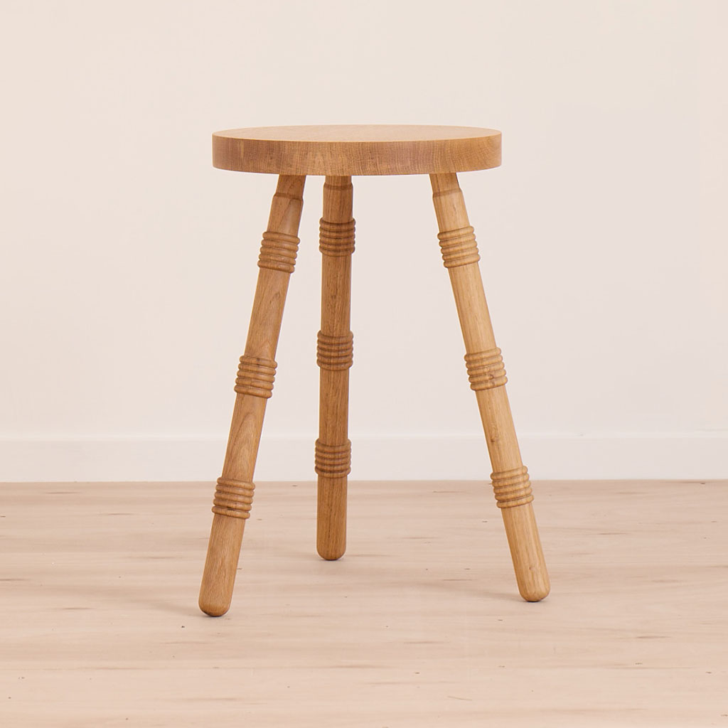 A handmade stool crafted from solid oak